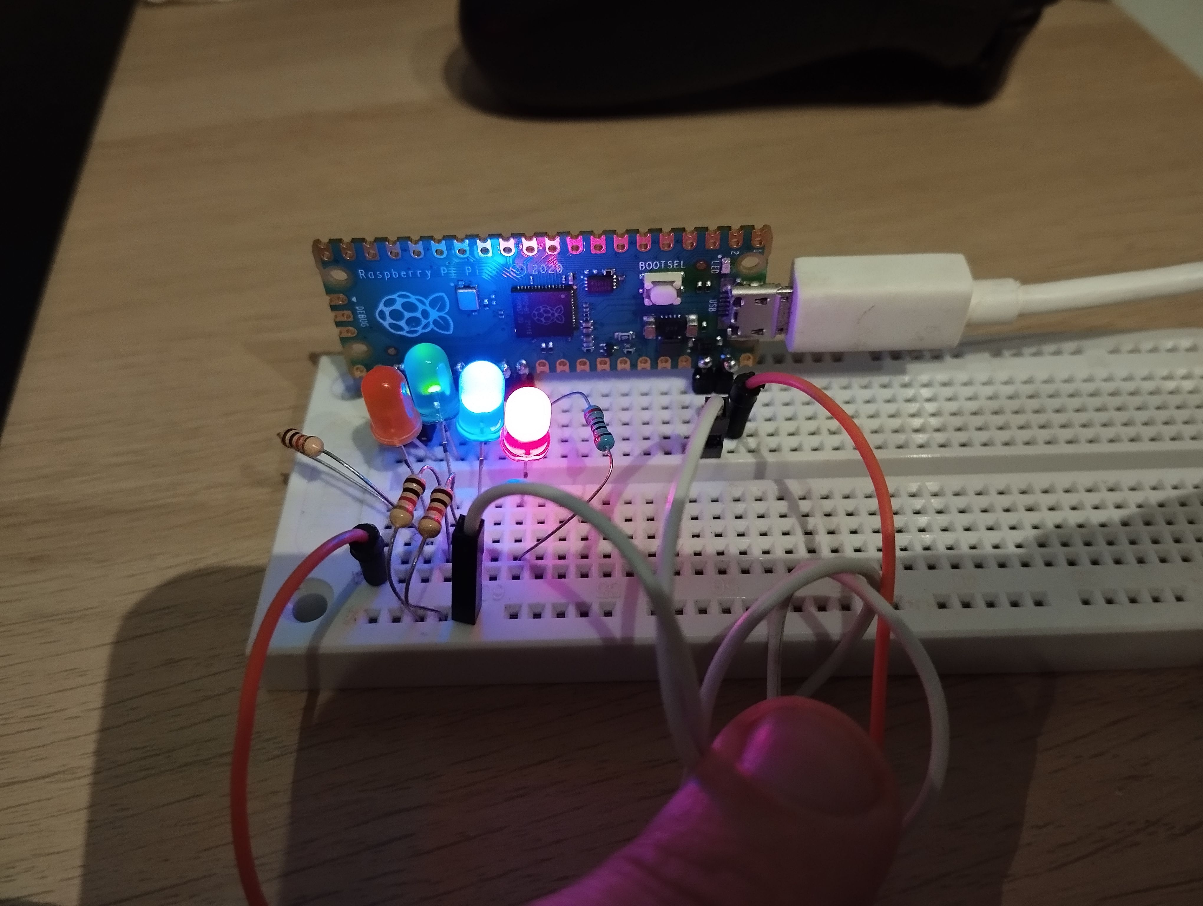 Breadboard that helped me figure out the firmware. Four colored LEDs, one for each important output signal, and a pushbutton are visible. Some of the LEDS are lit.
